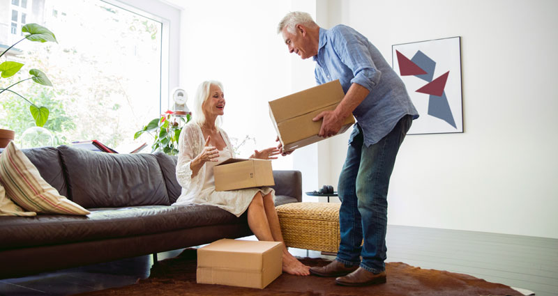 couple packing moving boxes