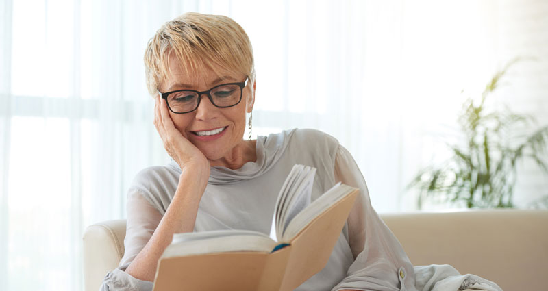 senior woman reading a book