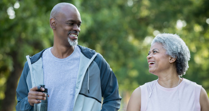man and woman walking outdoors