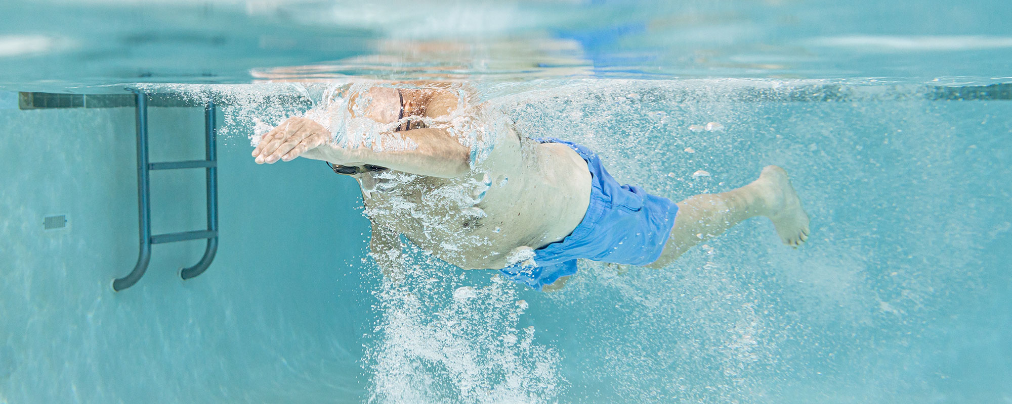 man swimming laps in the pool