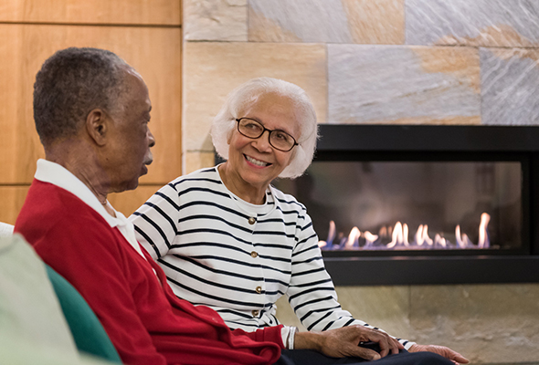 Residents by fireplace