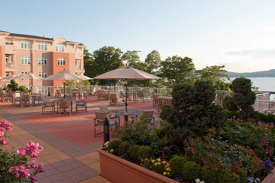 Outdoor terrace with planters filled with flowers