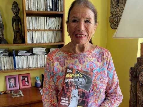 Muriel Fox holding her published book, 