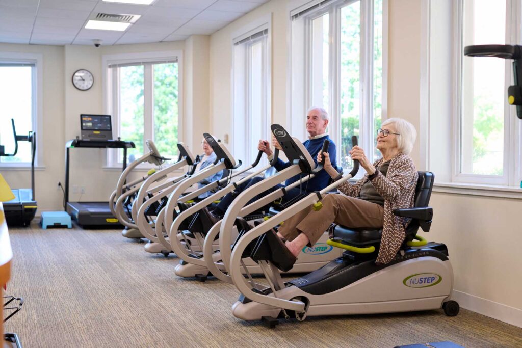 seniors working out on exercise bikes
