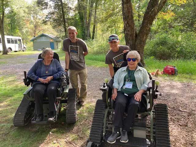 Kendal on Hudson residents sitting on all terrain track chairs